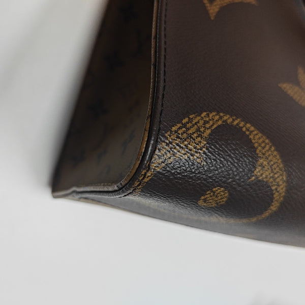 ONTHEGO MM Monogram Coated Canvas Brown