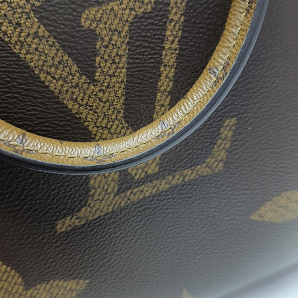 ONTHEGO MM Monogram Coated Canvas Brown