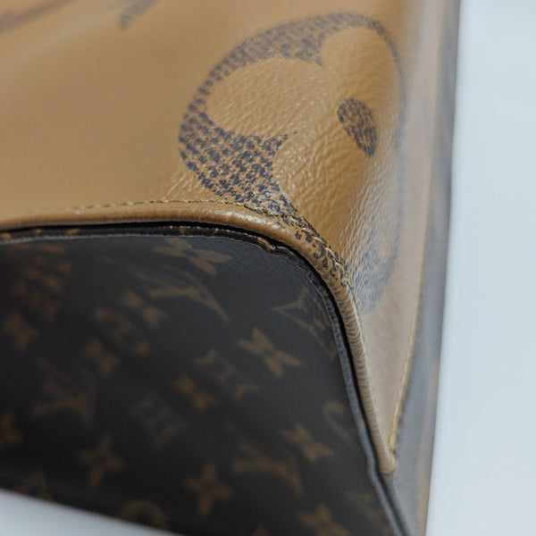 ONTHEGO MM Monogram Coated Canvas Brown