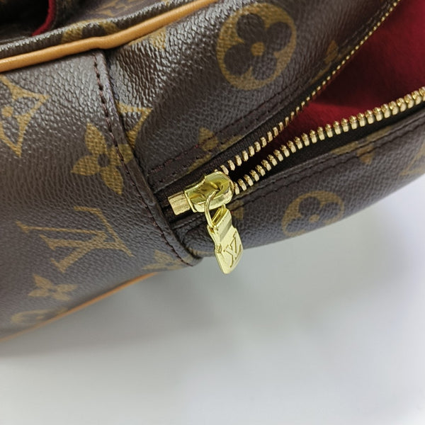 EXCENTRI-CITE Monogram Coated Canvas Brown