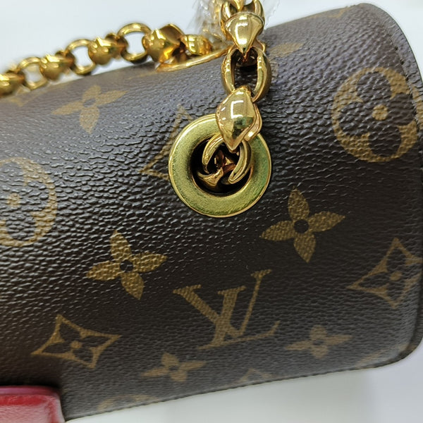 VICTOIRE Monogram Coated Canvas Brown