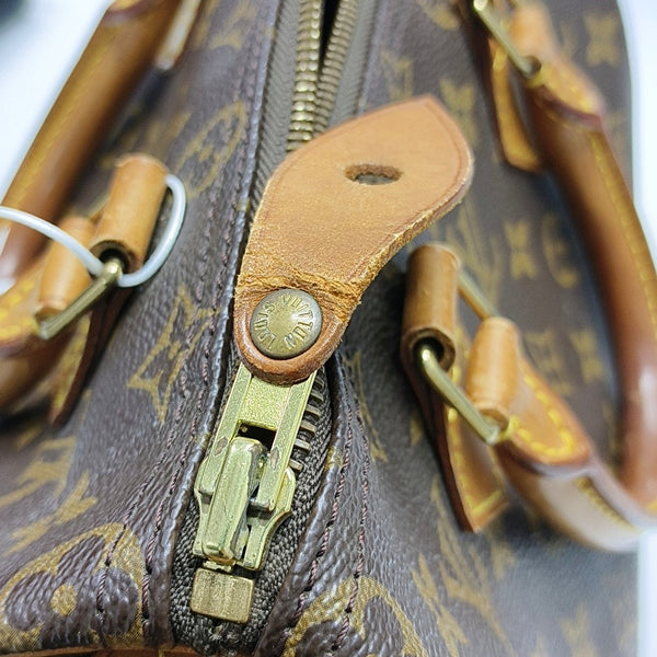 Authenticated pre-owned SPEEDY 25 Monogram Coated Canvas Brown - Top Handle Bag at Looply