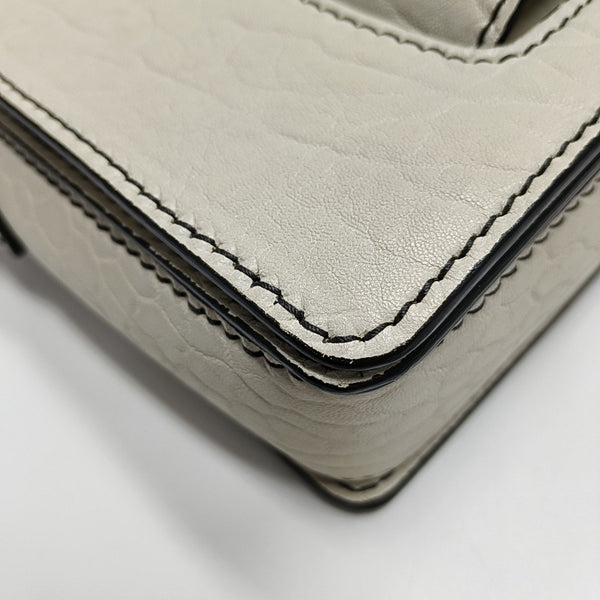 Dio(r)evolution Calfskin White