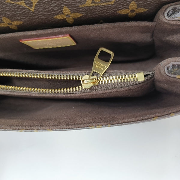MÉTIS EAST WEST Monogram Coated Canvas Brown