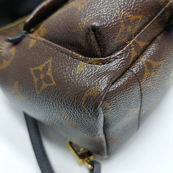 Authenticated pre-owned PALM SPRINGS Mini Monogram Coated Canvas Brown - Backpack at Looply