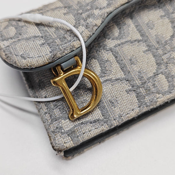 Monedero Saddle de lona Monogram gris