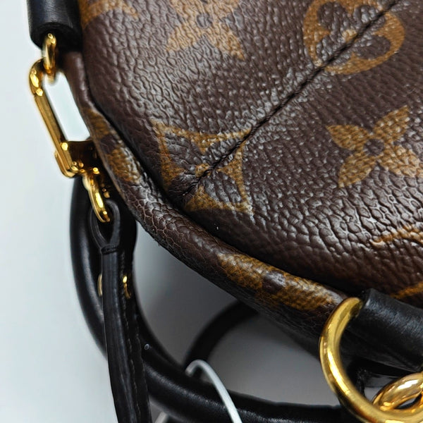 Authenticated pre-owned PALM SPRINGS Mini Monogram Coated Canvas Brown - Backpack at Looply