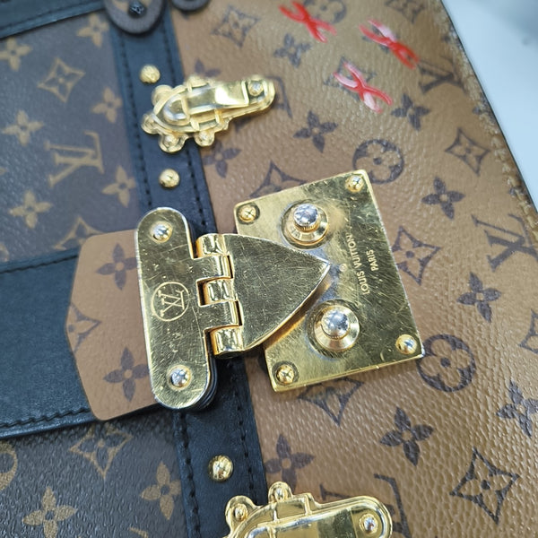 TRUNK Monogram Coated Canvas Brown