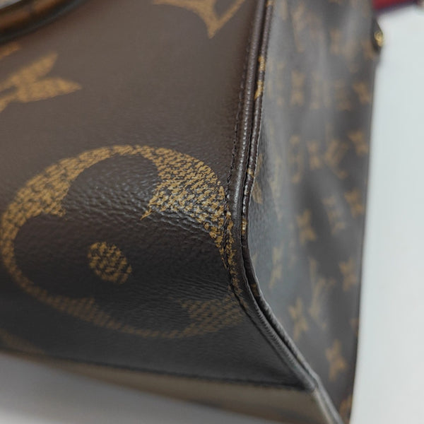 ONTHEGO MM Monogram Coated Canvas Brown