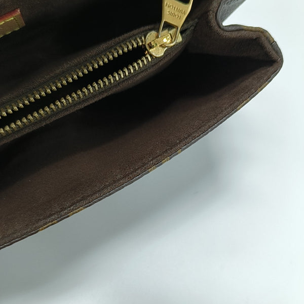 MÉTIS EAST WEST Monogram Coated Canvas Brown