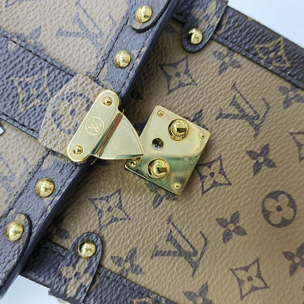 TRUNK Monogram Coated Canvas Brown