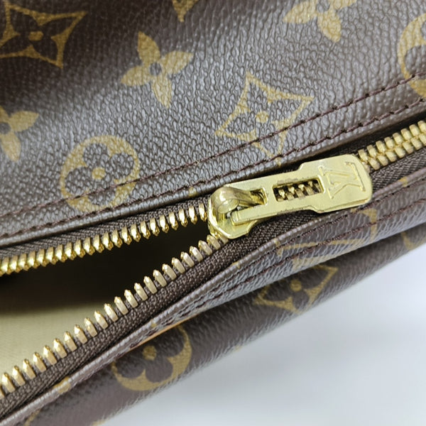 EXCURSION Monogram Coated Canvas Brown