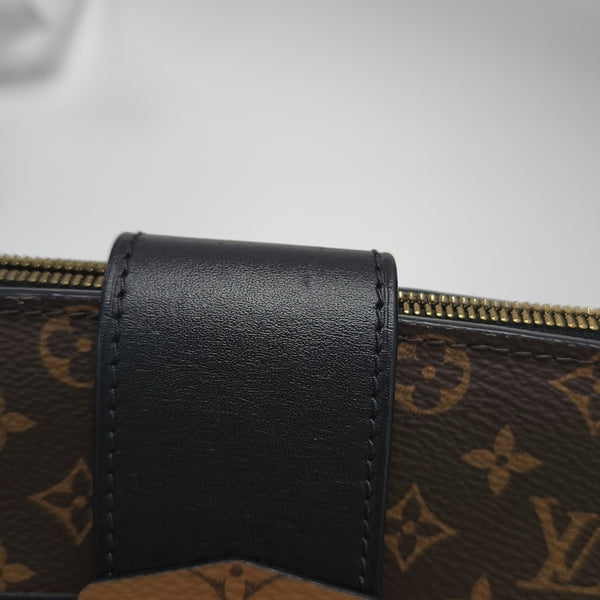TRUNK Monogram Coated Canvas Brown