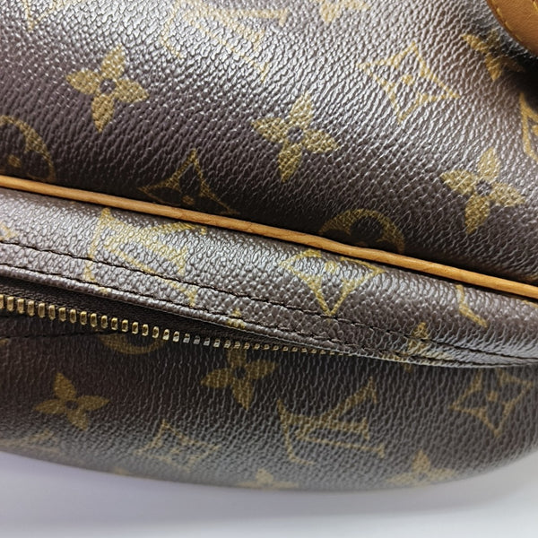 EXCURSION Monogram Coated Canvas Brown