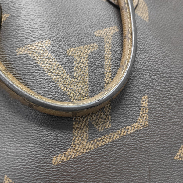 ONTHEGO MM Monogram Coated Canvas Brown
