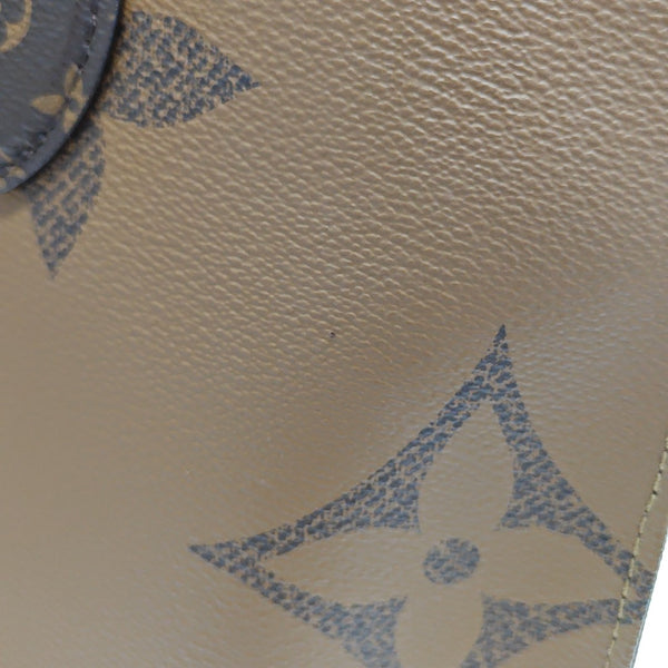 ONTHEGO MM Monogram Coated Canvas Brown