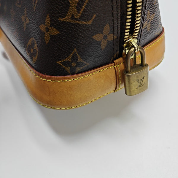 ALMA PM Monogram Coated Canvas Brown