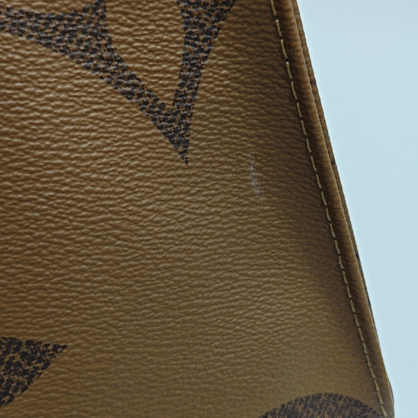 ONTHEGO MM Monogram Coated Canvas Brown