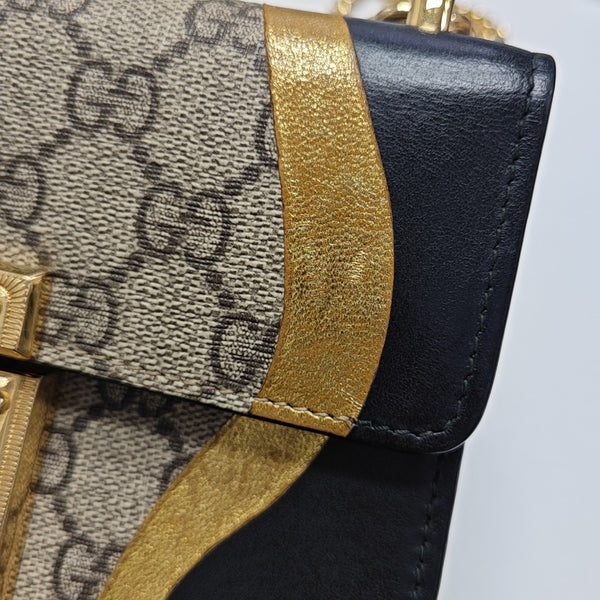 Padlock Small Monogram Coated Canvas Beige