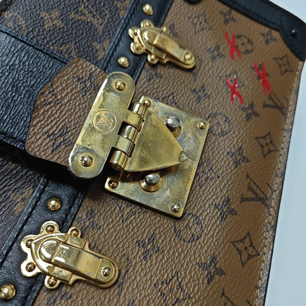 TRUNK Monogram Coated Canvas Brown