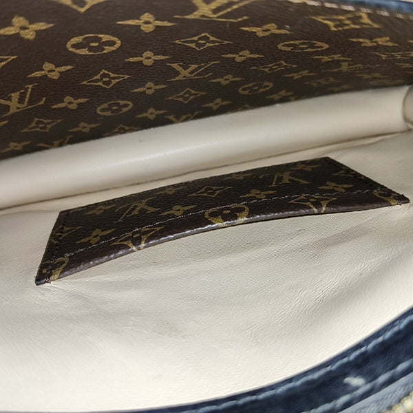 TRUNK Monogram Coated Canvas Brown