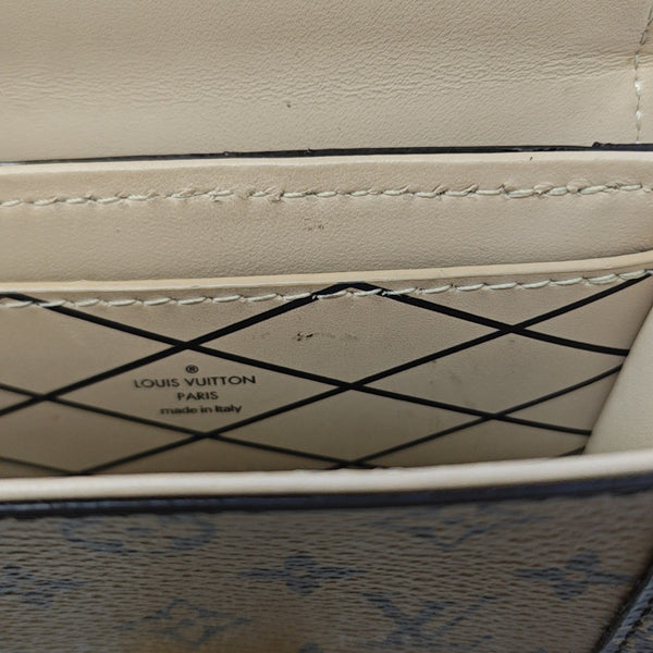 TRUNK Monogram Coated Canvas Brown