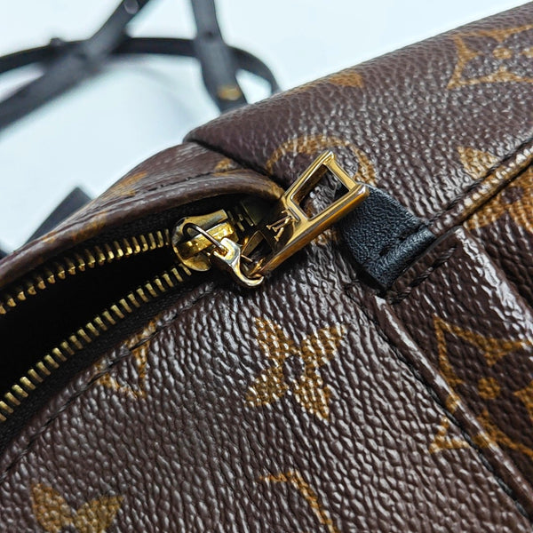 Authenticated pre-owned PALM SPRINGS Mini Monogram Coated Canvas Brown - Backpack at Looply