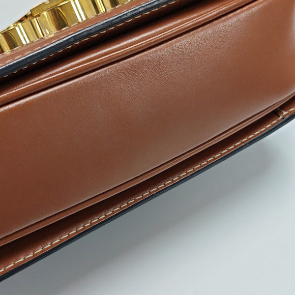 TRIOMPHE Small Coated Canvas Brown