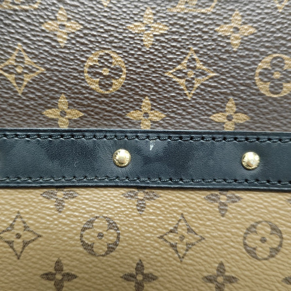 TRUNK Monogram Coated Canvas Brown