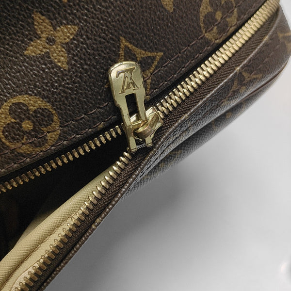 EXCURSION Monogram Coated Canvas Brown