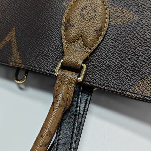 ONTHEGO MM Monogram Coated Canvas Brown