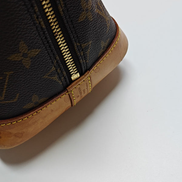 ALMA PM Monogram Coated Canvas Brown