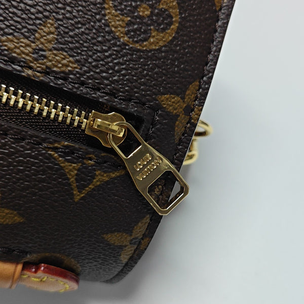 MÉTIS EAST WEST Monogram Coated Canvas Brown