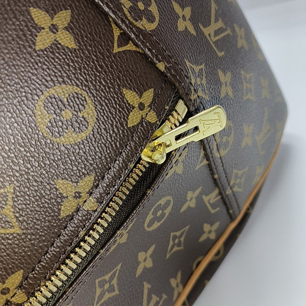 EVASION Monogram Coated Canvas Brown