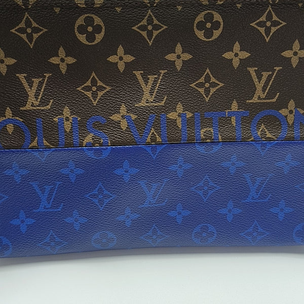 Pochette Voyag MM Monogram Coated Canvas Blue