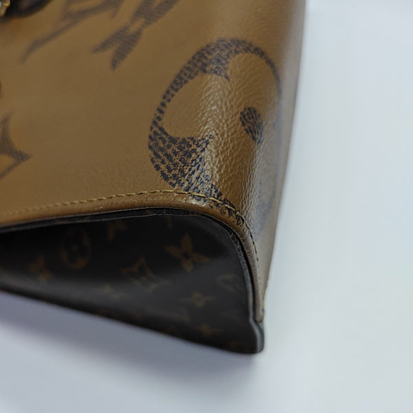 ONTHEGO MM Monogram Coated Canvas Brown