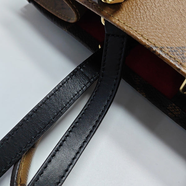 ONTHEGO MM Monogram Coated Canvas Brown