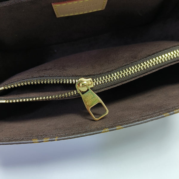 MÉTIS EAST WEST Monogram Coated Canvas Brown