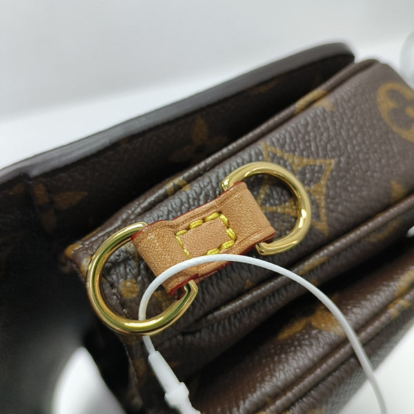 MÉTIS EAST WEST Monogram Coated Canvas Brown