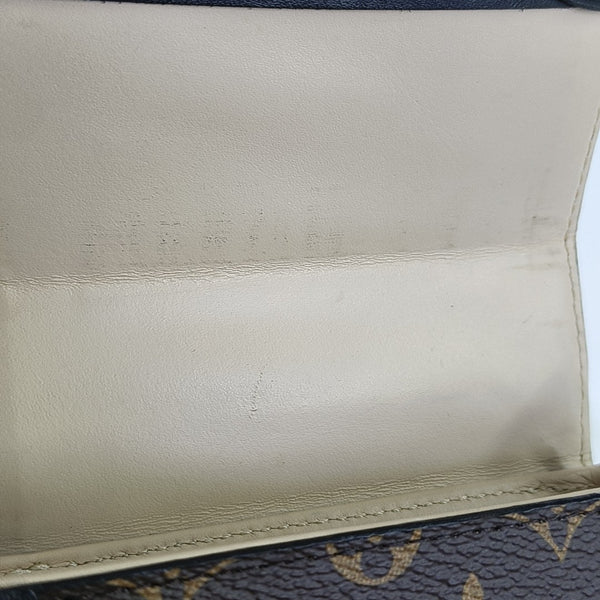 TRUNK Monogram Coated Canvas Brown