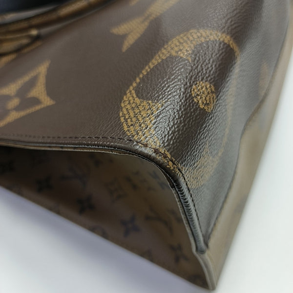 ONTHEGO MM Monogram Coated Canvas Brown