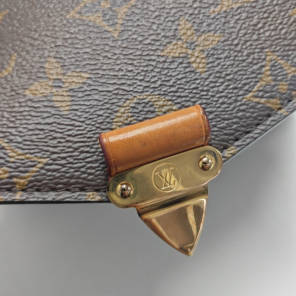 MÉTIS EAST WEST Monogram Coated Canvas Brown