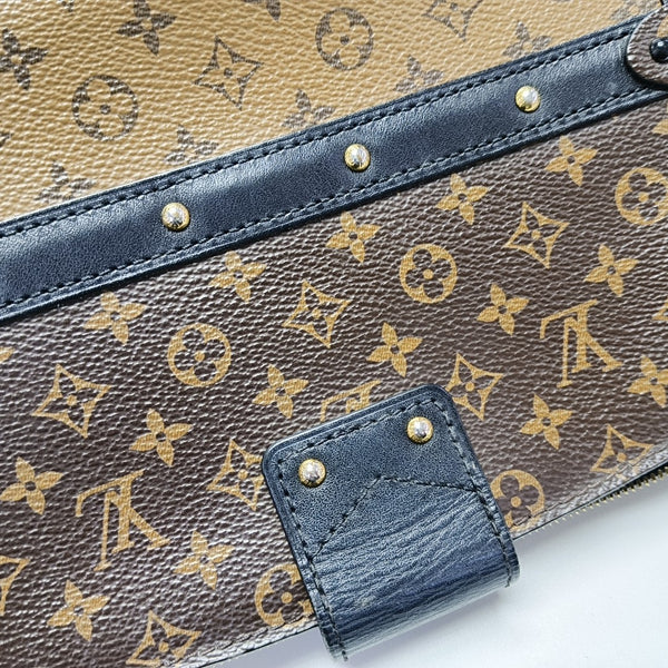 TRUNK Monogram Coated Canvas Brown