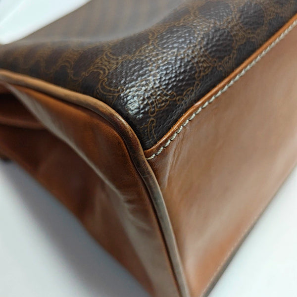Authenticated pre-owned MACADAM BLASON TRIOMPHE Coated Canvas Brown - Top Handle Bag at Looply