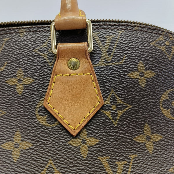 ALMA PM Monogram Coated Canvas Brown