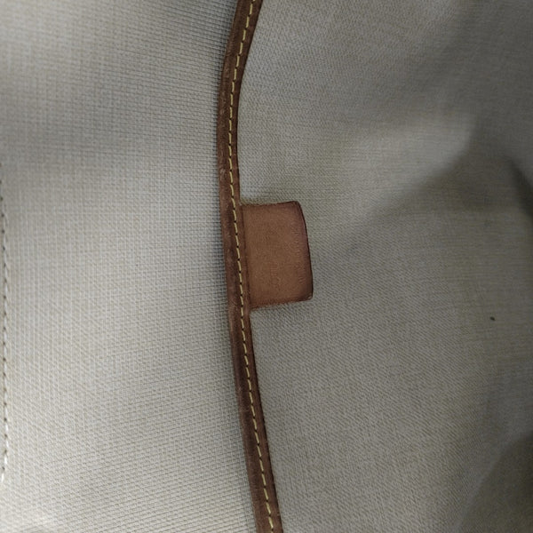 EXCURSION Monogram Coated Canvas Brown