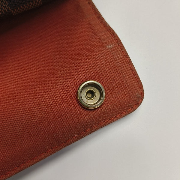 DISTRICT MM Damier Ebene Coated Canvas Brown