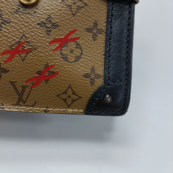 TRUNK Monogram Coated Canvas Brown