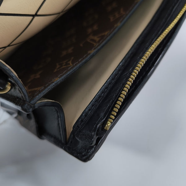 TRUNK Monogram Coated Canvas Brown