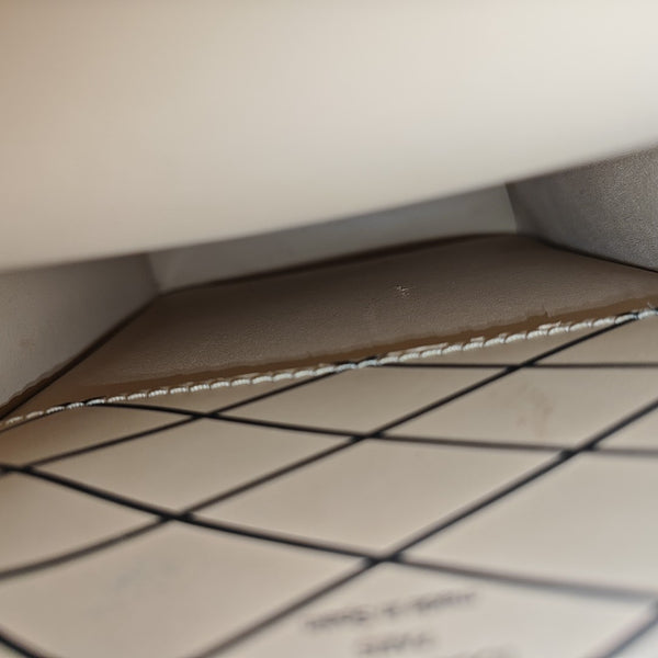 TRUNK Monogram Coated Canvas Brown